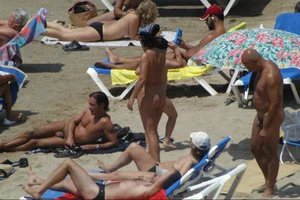 Girls on a nude beach in Sitges, Spain