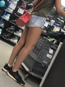 Sexy candid girl in jean mini shorts, great legs closeup creepshot at the store