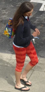 Beautiful brunette teen in orange patterned leggings