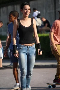 Hot brunette skateboarder in tight jeans and with hard nipples