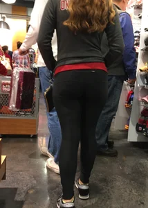 Pretty girl shopping with boyfriend in leggings with a nice ass