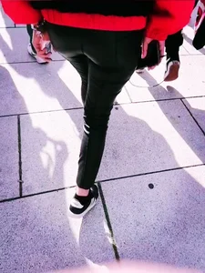 Ass in leather pants closeups on the street