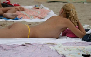 Beach voyeur girls in bikinis, thongs and topless