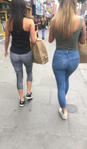 Sexy girl walking in grey patterned leggings with friend in tight jeans