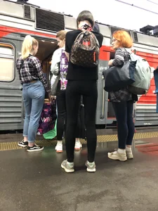 Teen Girl in Tights And Sneakers Standing on the Train Platform VPL Photos