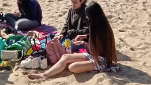 Beautiful Teen with Miniskirt resting on the beach