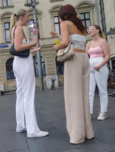 Long blonde braless in a white outfit (many pictures)