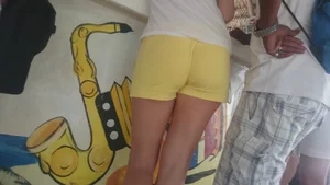Milf in yellow shorts with vpl and a wedgie