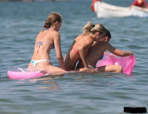 A bunch of sexy beach voyeur babes in bikinis, thongs and topless