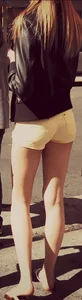 Skinny blonde girl in little yellow shorts with a tight ass