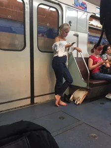 Barefoot subway blonde girl in a train creepshots