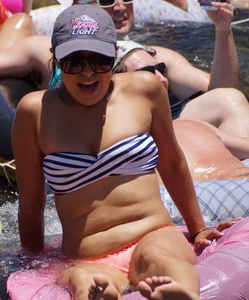 Sexy party girls in bikinis on a lake