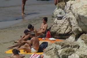 Girls on a nude beach in Sitges, Spain