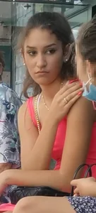 Candid teen in a pink short dress at the bus stop creepshot