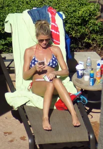 Blonde babe at the pool with sexy body in USA bikini