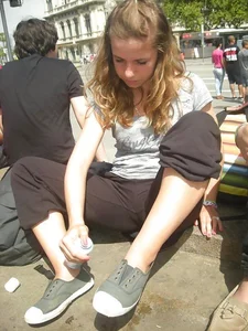 Skinny Girl Sitting on the Pavement Cameltoe Candid