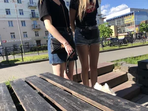 Girl in Denim Shorts with Amazing Hot Legs Fixing Her Sandals Street Candid Photo Gallery