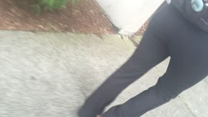 Girl with a nice ass in leggings walking down the street