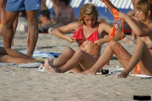 Beach voyeur girls in bikinis, thongs and topless