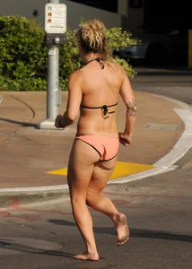 Sexy blonde with a nice ass in a peach bikini