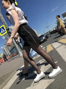 Skinny candid teen wearing shorts and black pantyhose crossing the street
