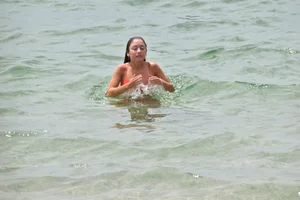 Two sexy ass girls on the beach in bikinis