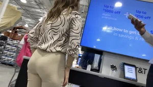 Plus Face shot - Gorgeous AT&T babe in beige pants  touching her ass with long red nails