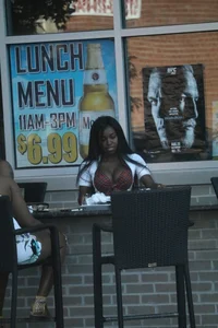 Sexy ebony Tilted Kilt employee in her uniform