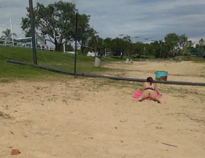White thong brunette babe laying out on the beach with her dog