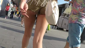 Sexy girl showing cheeks in little green shorts
