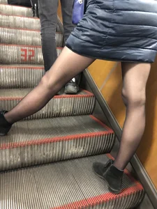 Tall Girl With Awesome Long Legs in Black Pantyhose Asleep in the Subway Train With Crossed Legs, Then Standing on the Escalator With Widely Spread Legs Hot Creepshots Gallery
