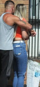 Blonde in skintight jeans shopping with boyfriend