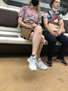 Amazing Hot Girl in a Skirt and Sneakers Sitting Cross-Legged in the Subway Train and on the Escalator Candid Photos Gallery