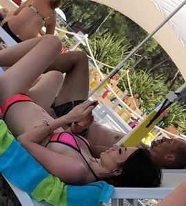 Sexy girl at the pool in pink bikini