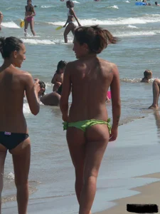 Bunch of sexy babes at the beach in thong bikinis