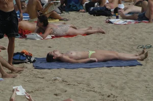 Topless girls on a beach in Barcelona