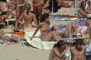 Topless girls on a beach in Barcelona