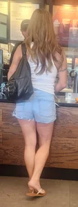 Short shorts on hot milf buying coffee