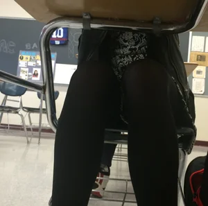 College Student's Legs in Black Pantyhose Under Desk Photos