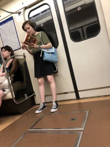 Candid cutie with nice pale legs in a subway train