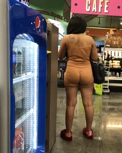 Latina with hard nipples and a big booty in tight spandex shorts outfit
