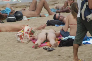 Topless girls on a beach in Barcelona