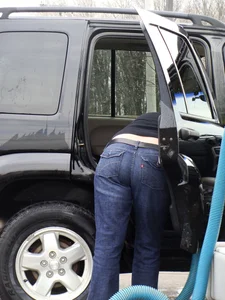 Girls cleaning their cars in jeans and pants