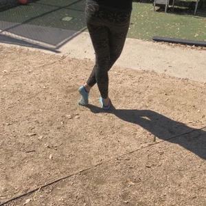 Shoeless Girl in Blue Socks on the Street Creepshot