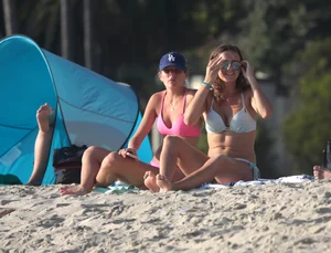 Two sexy friends out on the beach in bikinis