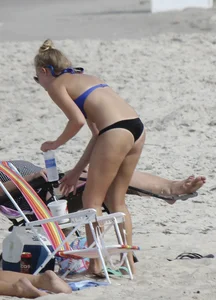 Florida blonde in blue and black bikini on the beach