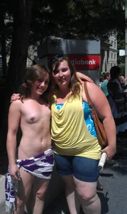 Nude small boobed girl at Toronto pride parade with a couple bonus girls