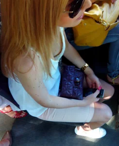 Redhead in Sunglasses Breast Peek