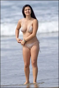 Sexy brunette chick at the beach with big tits and a nice ass in thong bikini