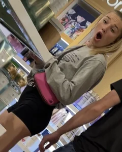 Sexy And Skinny Girl in Shorts Standing with an Opened Mouth Mall Creepshot